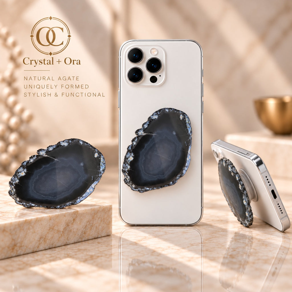 Charcoal agate adhesive phone grip with subtle gray bands and an irregular edge on white phones