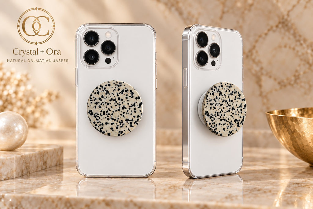 Round cream Dalmatian jasper Halo phone grip with black spots on two white phones