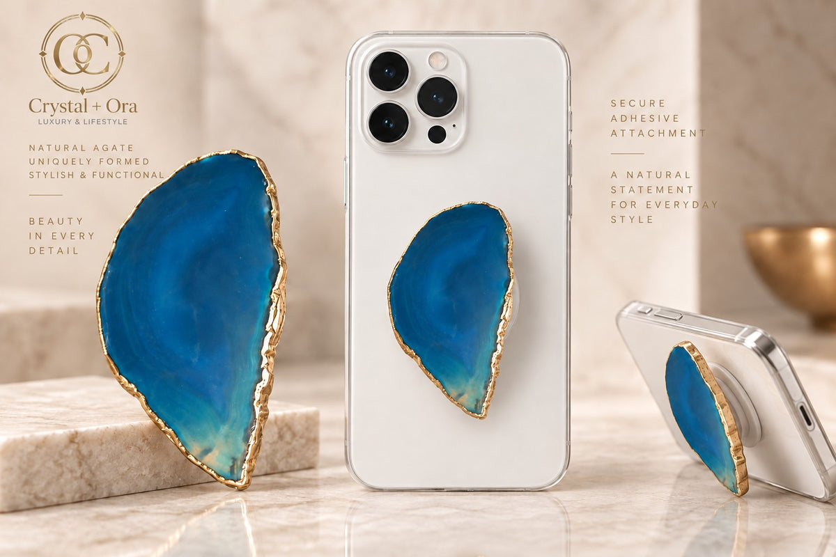 Freeform blue agate phone grip with gold-tone edging and a pale turquoise tip on white phones