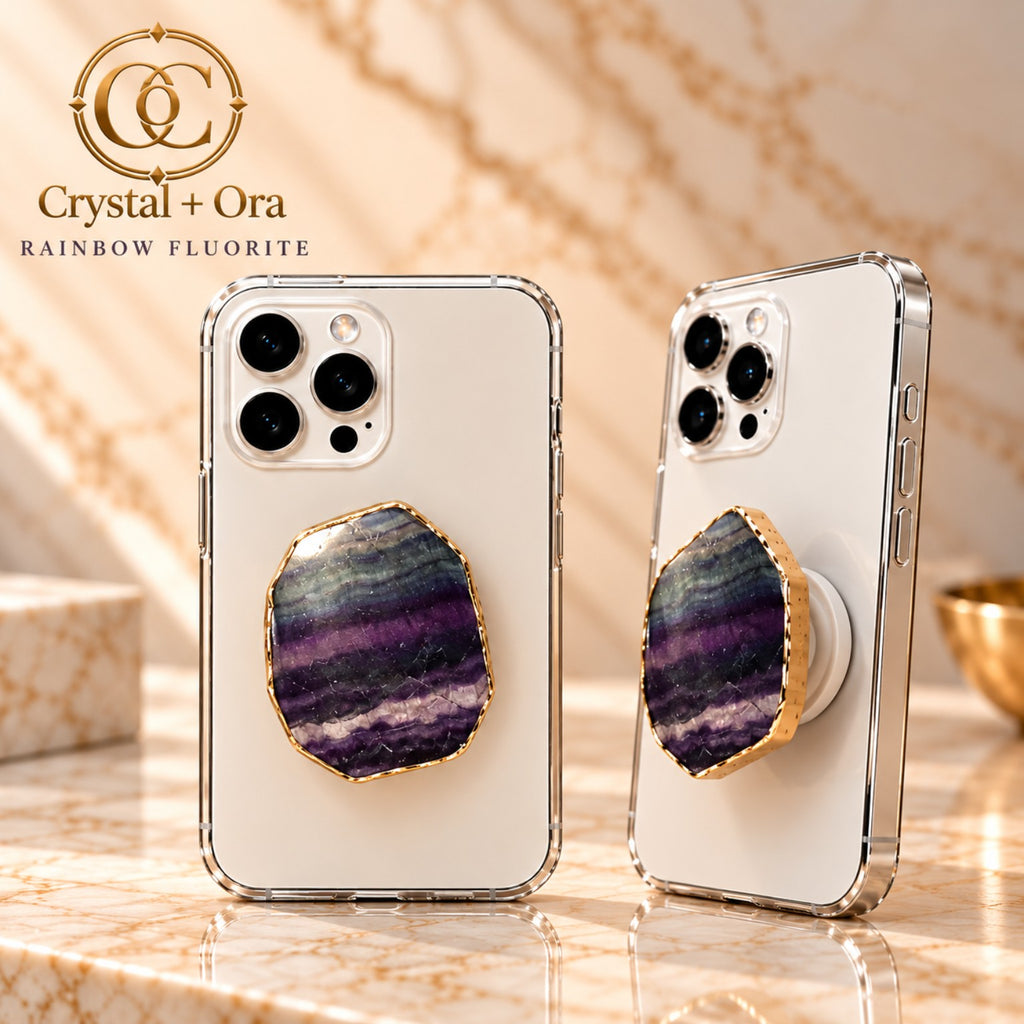 Gold-edge rainbow fluorite MagSafe phone grip with purple, green and pale bands on white phones