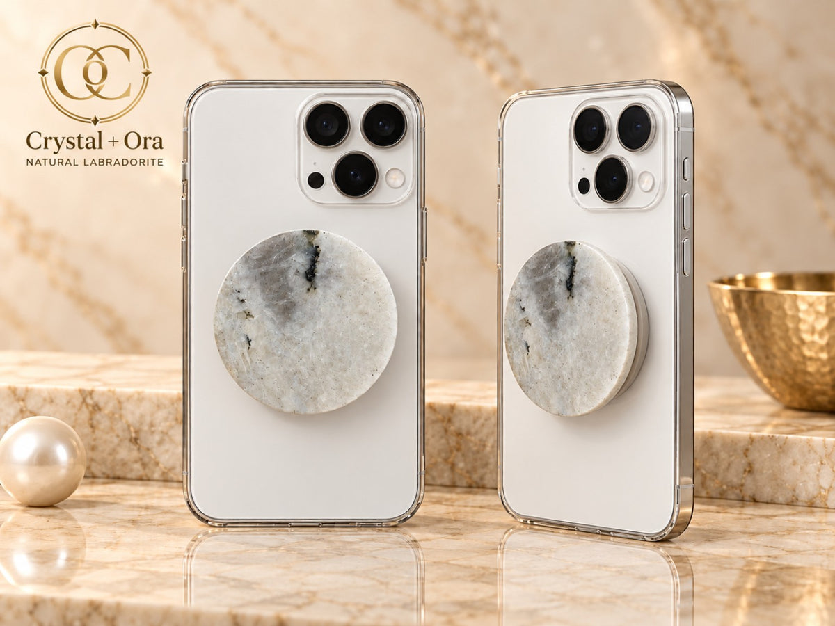 Round pale gray and white labradorite Halo phone grip with dark mineral markings on white phones