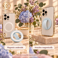 Pale blue silicone phone ring with tiny sparkle flakes showing magnetic underside and attachment to a compatible case