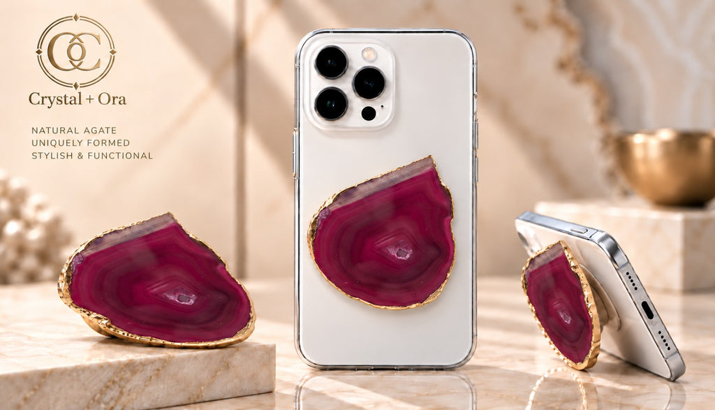 Raspberry agate adhesive phone grip with gold-tone edging and a small druzy center on white phones