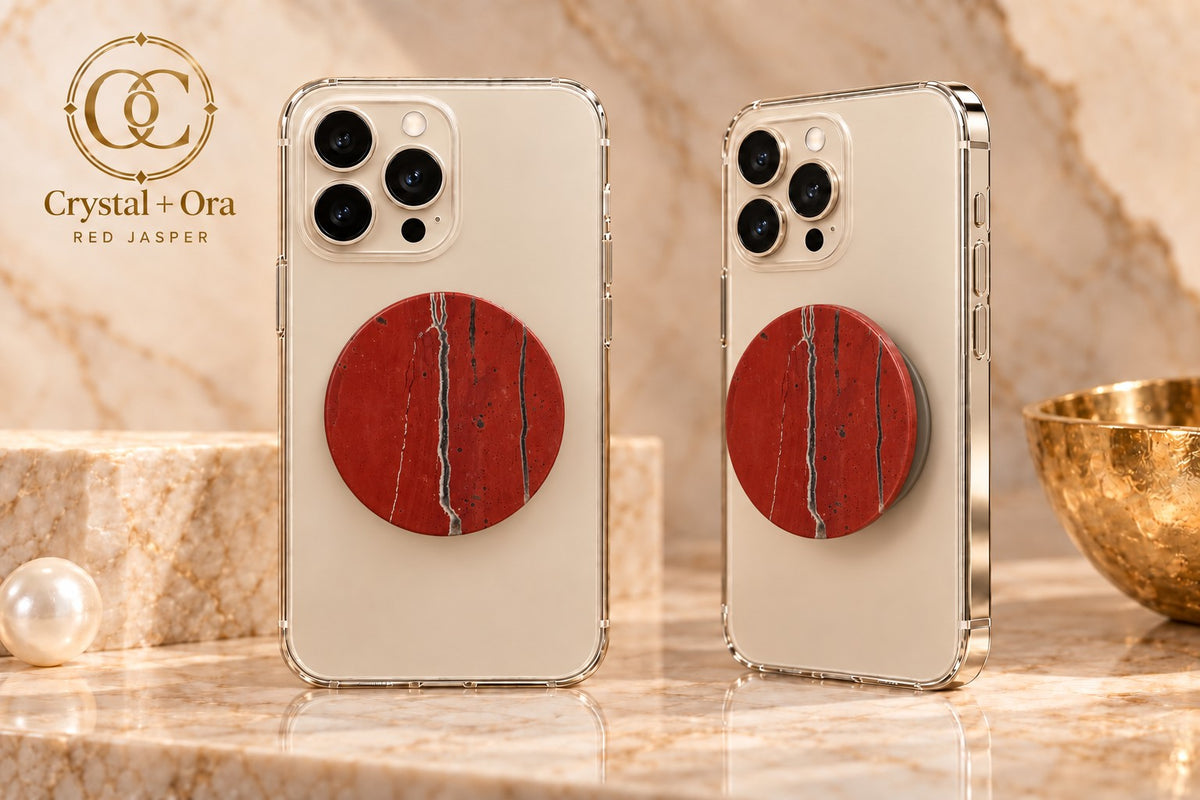 Round red jasper Halo phone grip with dark and pale vertical veins on two light-colored phones